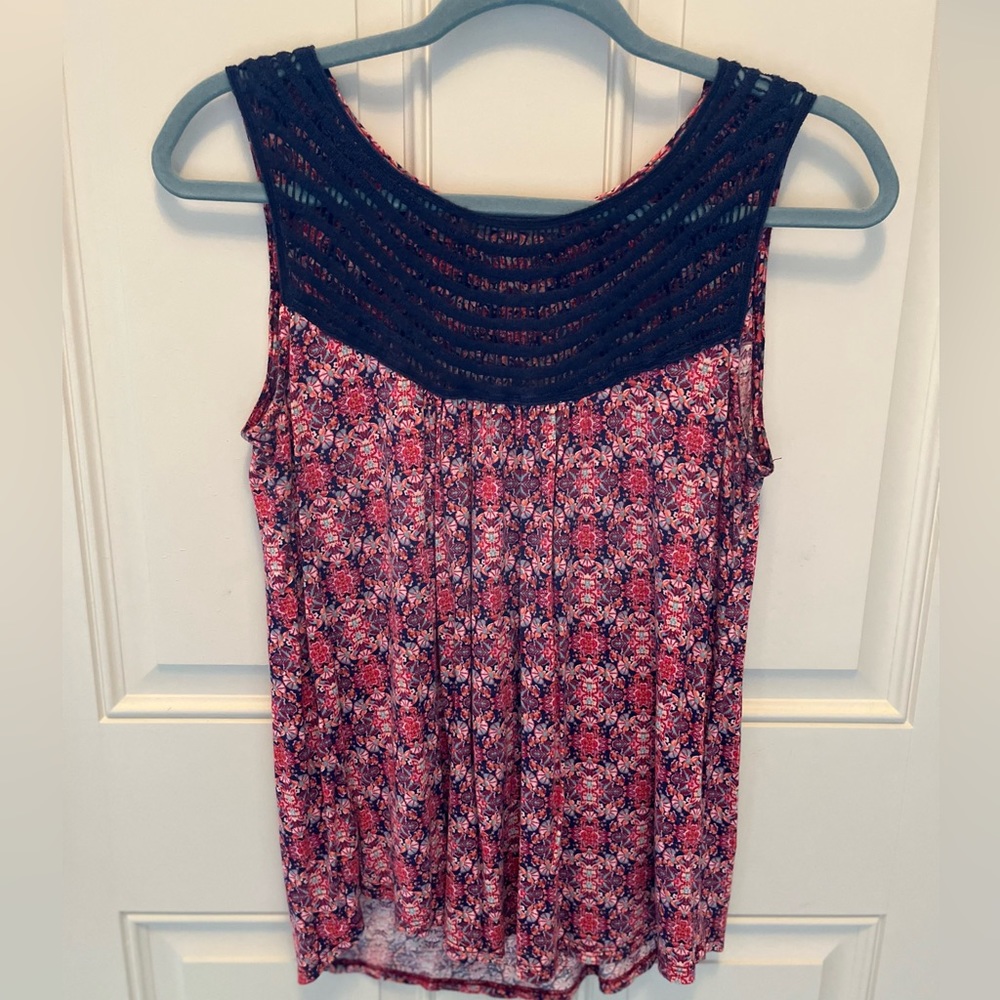 Sleeveless blouse with crochet front detail